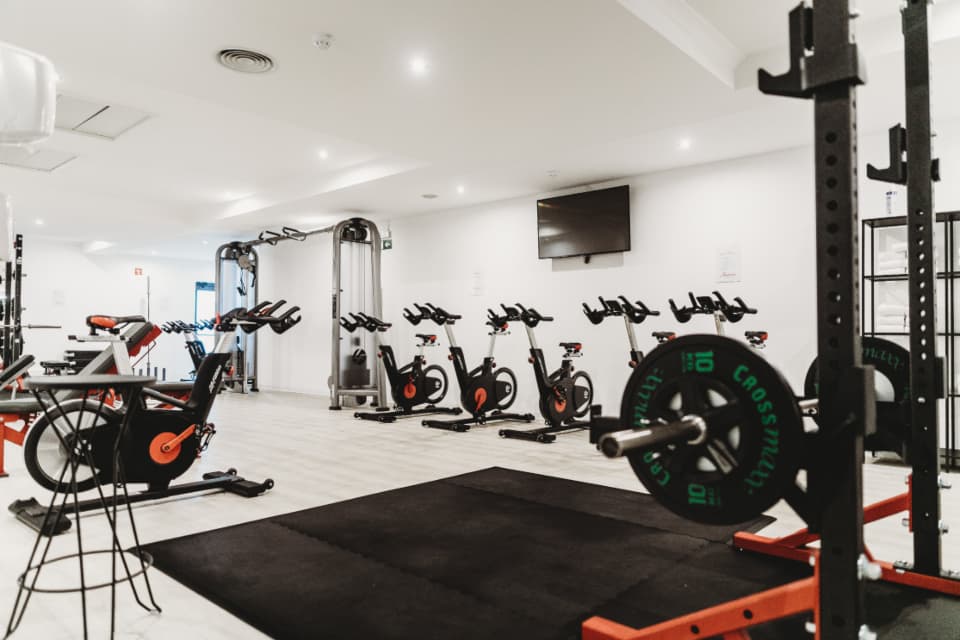 The main floor with bikes, racks and rubber flooring